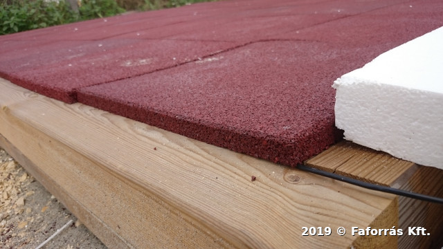 Image showing rubber
flooring tiles installed in an outdoor testing environment.