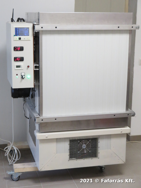 Image showing a
large metal box on trolley wheels, with displays and instruments.